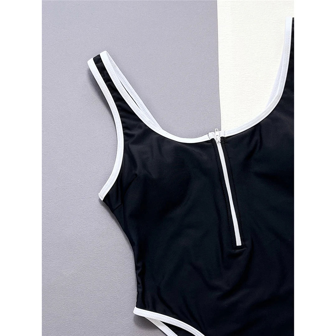 Sophisticated High Leg Cut One-Piece Swimsuit with Tasteful Splicing Detail and Front Zipper in Black, Made from Nylon and Spandex, Includes Pad for Extra Support, Ideal for Women, Available in Sizes S to L