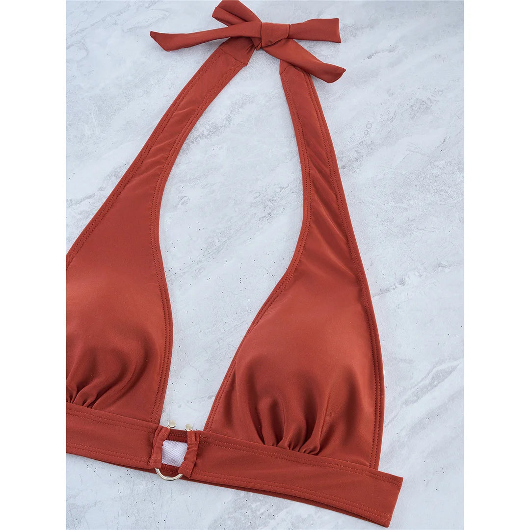 Radiant Five-Color Halter Bikini Set with Chic Metal Ring, Crafted from Nylon and Spandex. Brazilian Style, Features Wire Free Support and Low Waist Cut, Ideal for Middle Aged Women. Fits True to Size and Comes with Padding for Extra Comfort. In Colors of Coffee, Black, Green, Orange, and White. New and in Stock.