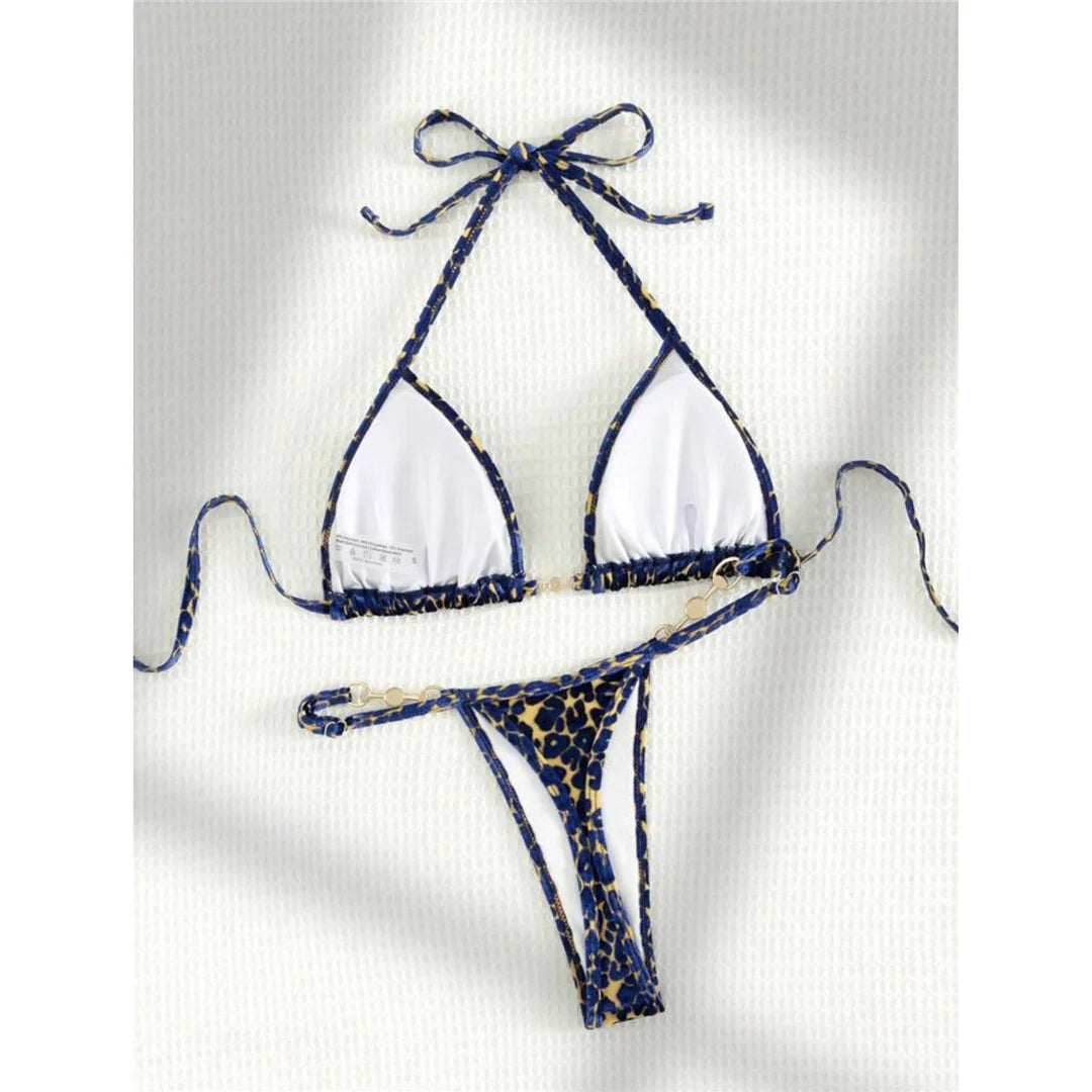 Leopard Print Mini Micro Thong Bikini Adorned with Delicate Pearls. Two-Piece Swimwear made of Nylon and Spandex. Features Low Waist, Wire-Free Support, and True to Size Fit. Pattern: Leopard Print. Includes Padded Cups, Available in Sizes: S, M, L, Female, Varleinsar, V5207. Colors Available: Blue Leopard, Green Leopard, Yellow Blue Leopard. In-Stock with Free Shipping.