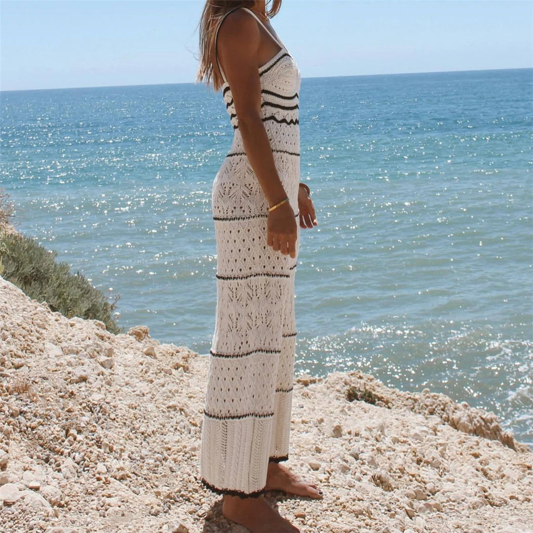 Splicing backless crochet tunic in white for women, expertly knitted as a beach cover-up. Features a playful hollow-out design. Made from Nylon, Polyester, and Cotton. This solid pattern tunic fits true to size. Available in sizes S, M, and L. Free shipping provided on this perfect companion for seaside adventures. Ideal for women aged 18 to 35.