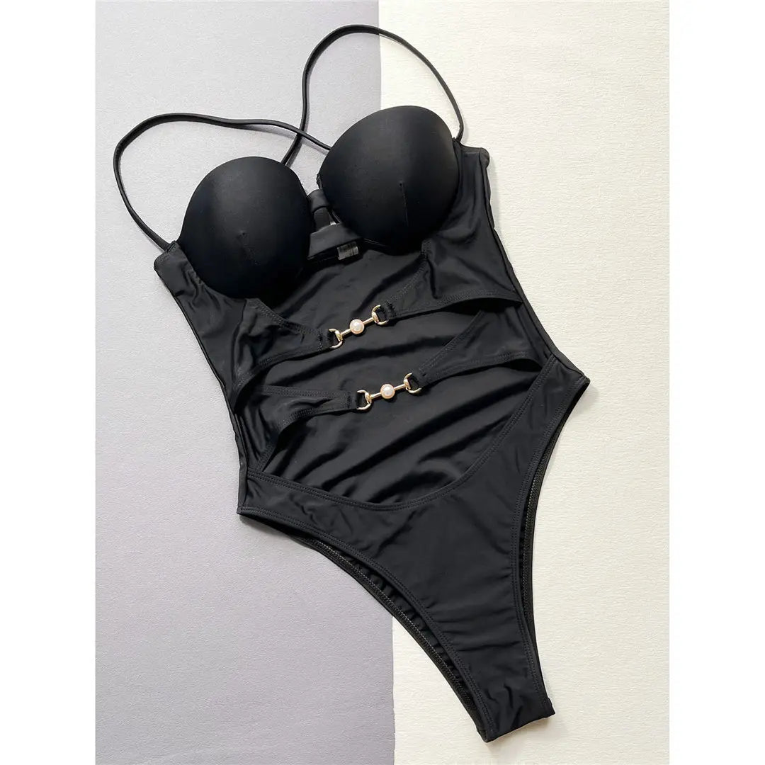Supportive and Stylish One-Piece Swimsuit for Women, Featuring Underwire, Bra Cups, and Captivating Cut-Out Design. Cross-Back Detail and High-Leg Cut for Figure Accentuation. Made from Solid Black Nylon and Spandex. True to Size Fit with Comfort, Perfect for Beach or Pool.