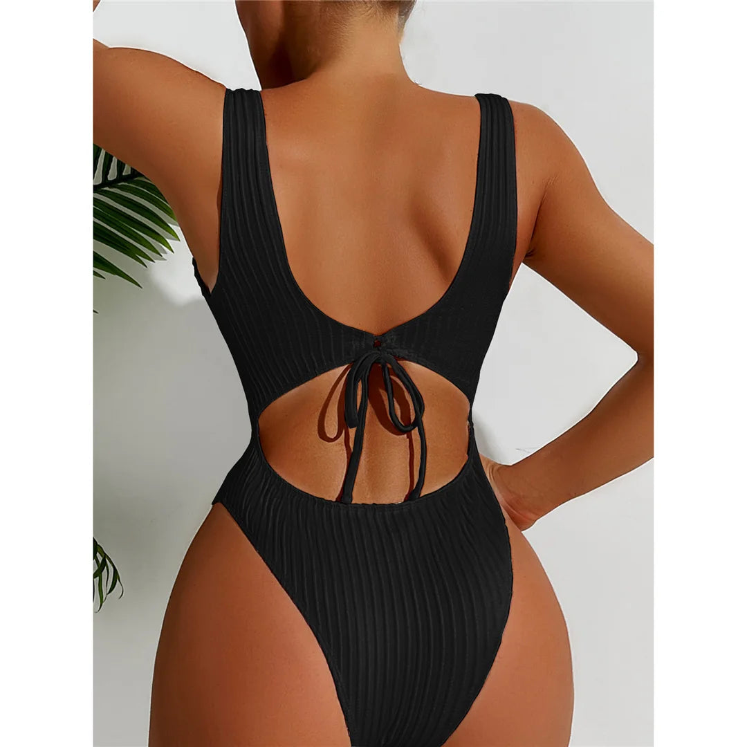 Ribbed cut-out backless one-piece swimsuit, strappy high-leg design, adjustable triangle top, monochrome solid pattern, polyester spandex blend, women&#39;s daring and elegant swimwear.