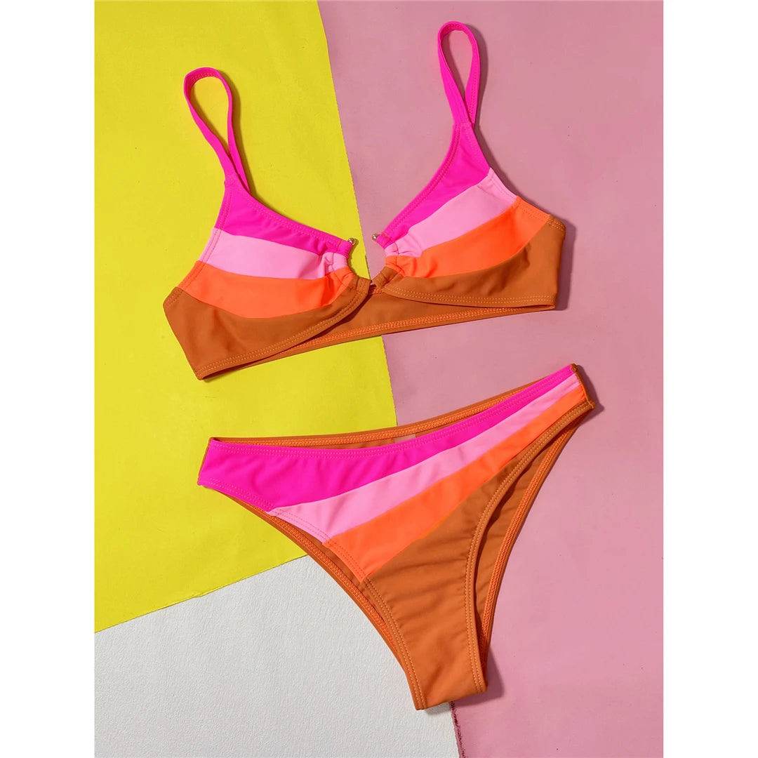 Eye-Catching Brazilian Bikini Set for Women, Features an Edgy Splicing Design with Cut-Out Details and High-Cut Bottom, Crafted from Nylon and Spandex in Hot Pink Color, Features a Patchwork Pattern, Offers Wire Free Support, Fits True to Size, Perfect for Standout Style at Beach or Poolside Outings.