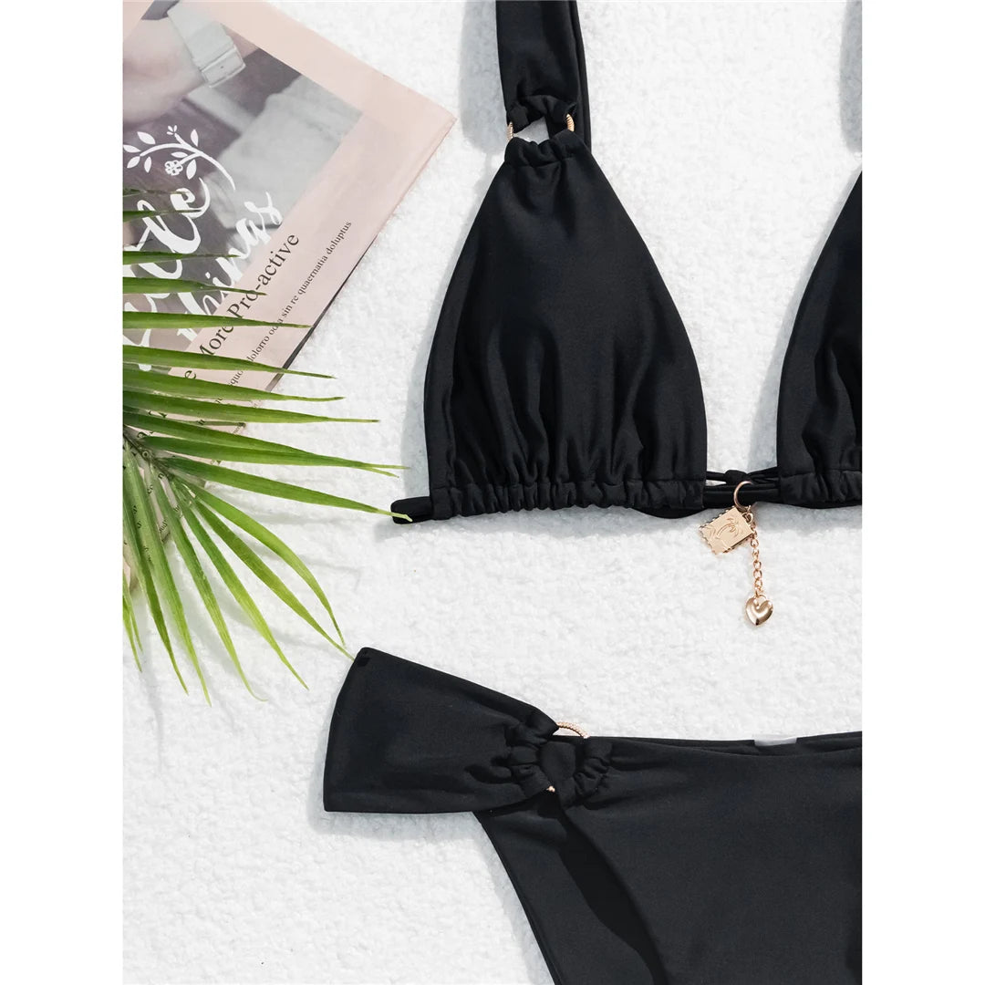 High-leg cut bikini set with stylish metal ring details and padded design for a chic and modern swimwear look for women.