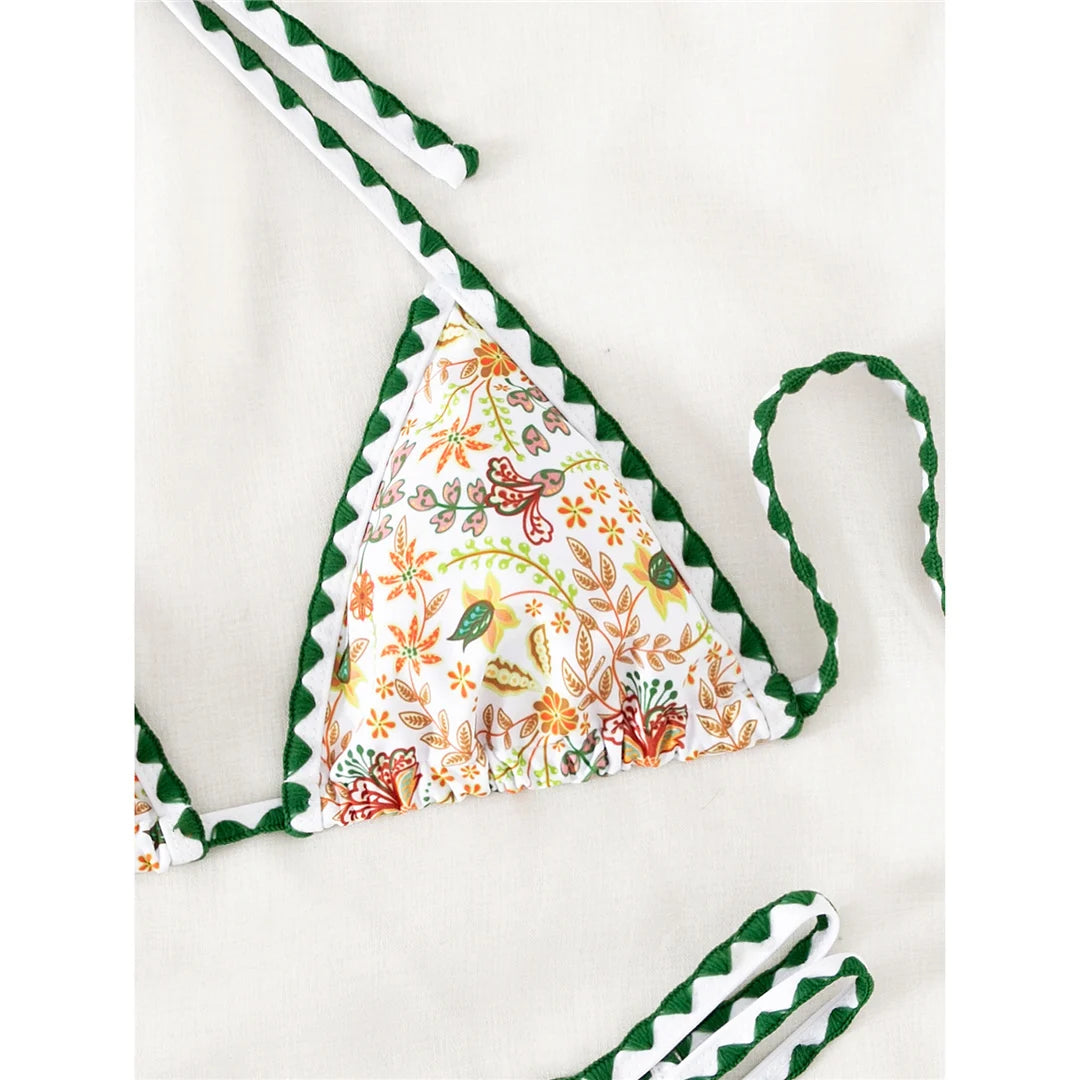 Women's Flower Printed Halter Brazilian Bikini Set with Floral Print Design. Made from Nylon and Spandex, Fits True to Size, with Wire Free Support. Features a Low Waist Design for a Flattering Look. Available in Sizes S, M, L and in Colors Dark Green Print, Dark Green, and Multicolor. Perfect for a Vibrant and Stylish Beachwear Option.