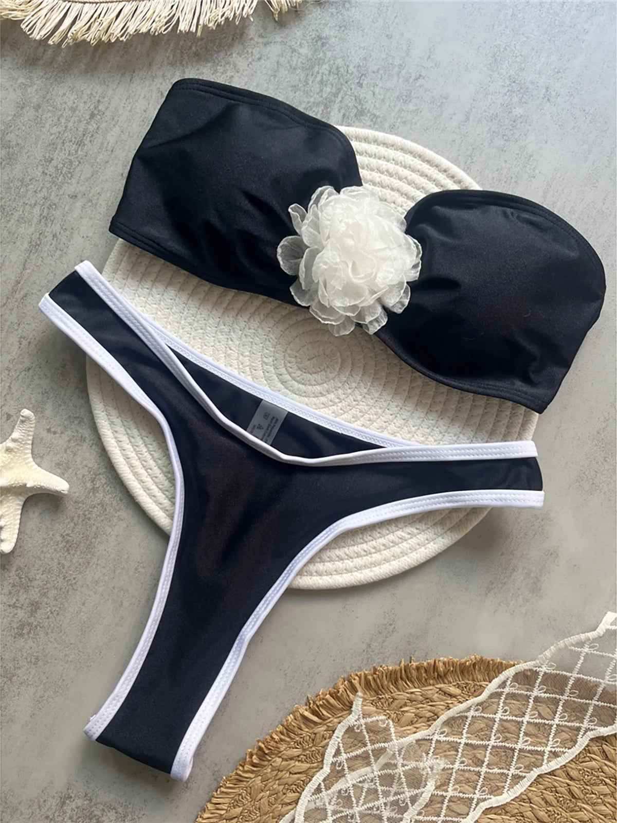 3D flowers bandeau bikini set with mini thong design and floral embellishments for a bold and stylish look.