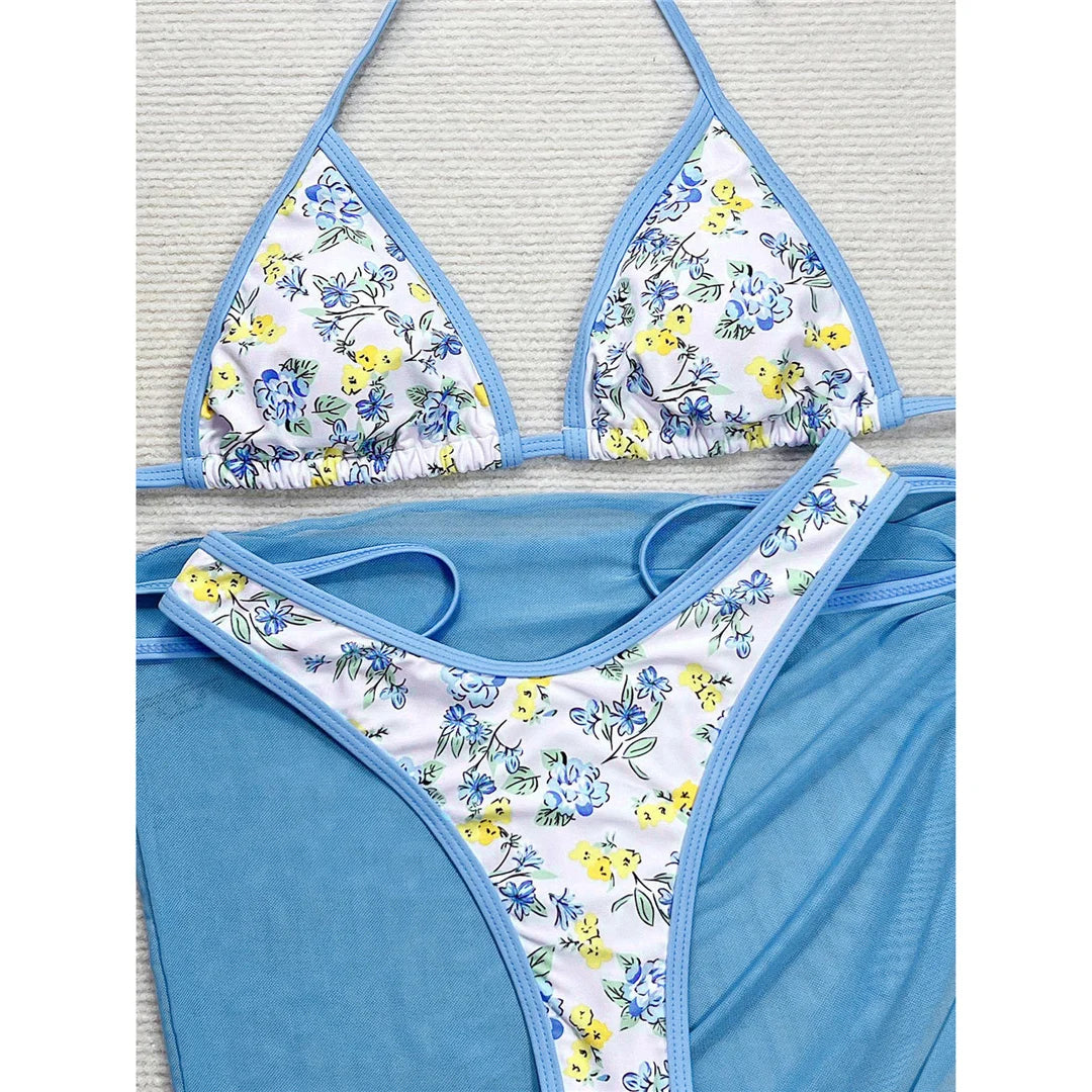 Halter thong bikini set with floral print and stylish sarong, offering a blend of elegance and versatility for women.