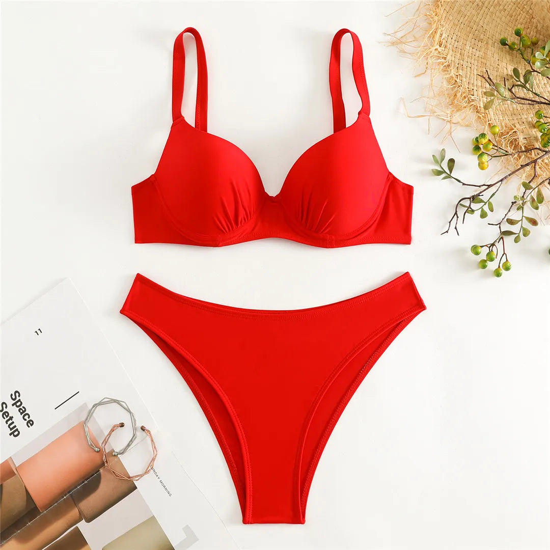 Underwired Bra Cup Brazilian Bikini Set in Solid Black and Red Colors. Made of Nylon and Spandex with Low Waist and Padded Design, Offers Stunning Fit and Style. Available in Sizes S to XL. Perfect for Female Middle Age Group and Adults. Item is in Stock, Includes Free Shipping.