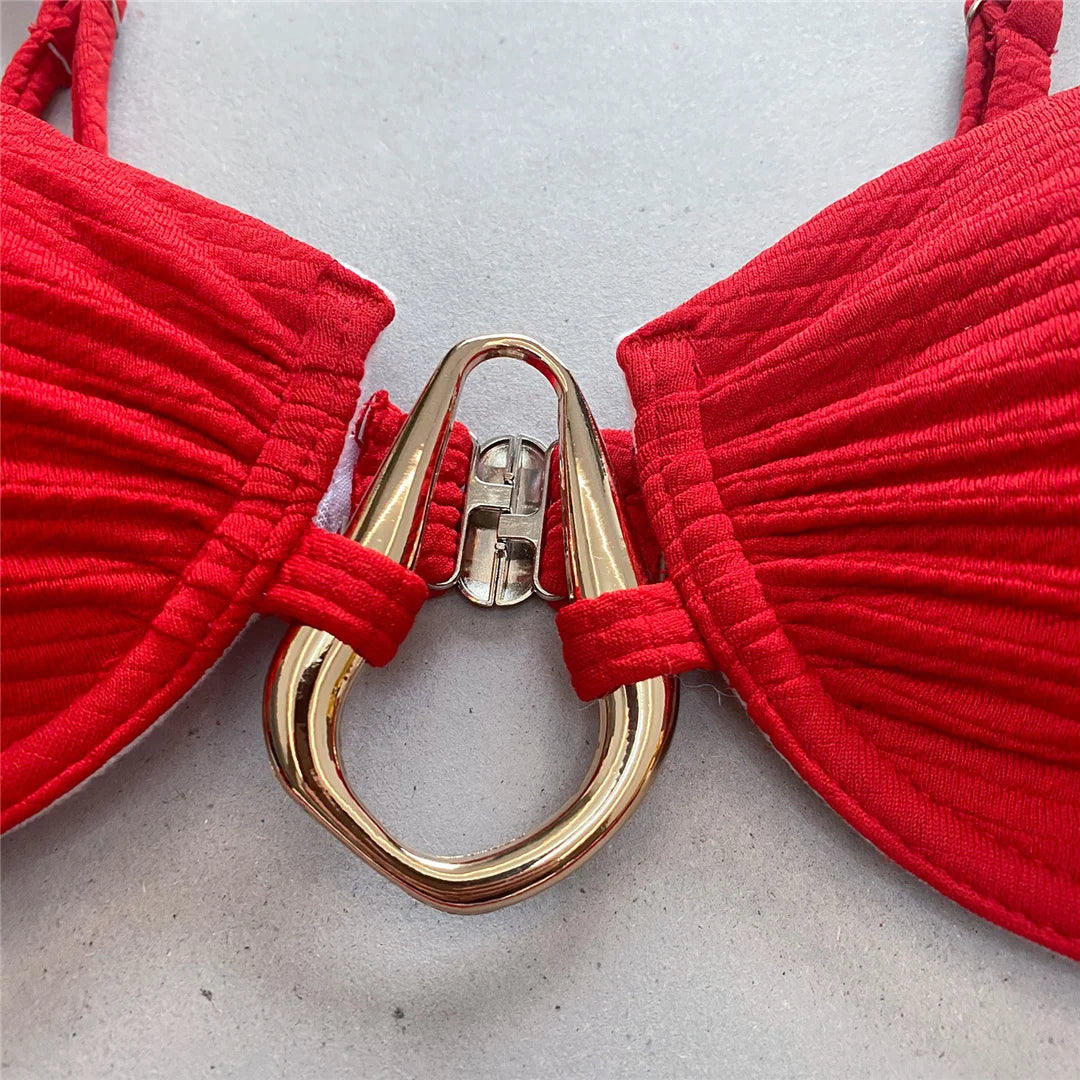 Edgy Metal Ring Wrinkled Two-Piece Bikini Set. Underwired for Support, Made of Solid Nylon and Spandex. Features Low Waist, Fits True to Size. Includes Padded Cups, Available in Sizes: S, M, L, Female, Middle Age. Colors Available: Black, Red. In-Stock with Free Shipping.