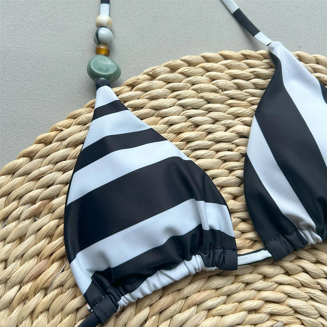 Halter striped high leg bikini set with padded design for a chic and nautical look for women.