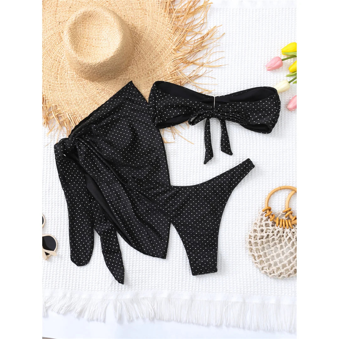 Polka dots bandeau bikini set with matching sarong, three-piece ensemble, polyester spandex blend, wire-free support, low waist, women's dot swimwear, playful and retro style.