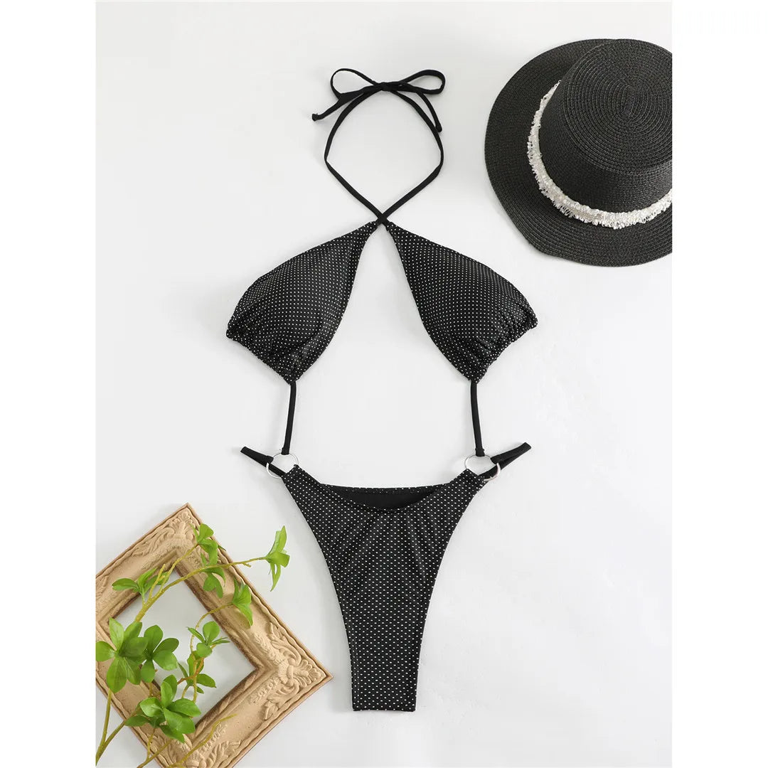 Minimalistic Design One-Piece Monokini for Women in Dot Pattern, Crafted with Nylon and Spandex. Features a Daring Micro Thong Silhouette, Fits True to Size, Perfect for Creating a Bold Poolside Statement. Comes with Pad, Available in Black.