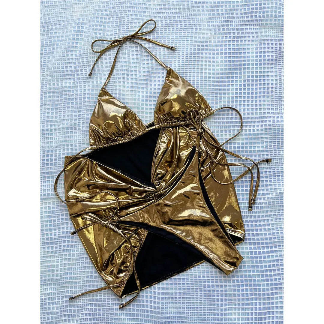 Redefining Poolside Fashion, Three-Piece Bikini Set for Women, Included Striking Skirt for Sophistication. Halter Top Made from PU Faux Leather. Made from Solid Gold Nylon and Spandex, Low Waist, Wire-Free Support. True to Size, Equipped with Pad for Extra Comfort. Unique Fusion of Functionality and Runway-Ready Style.