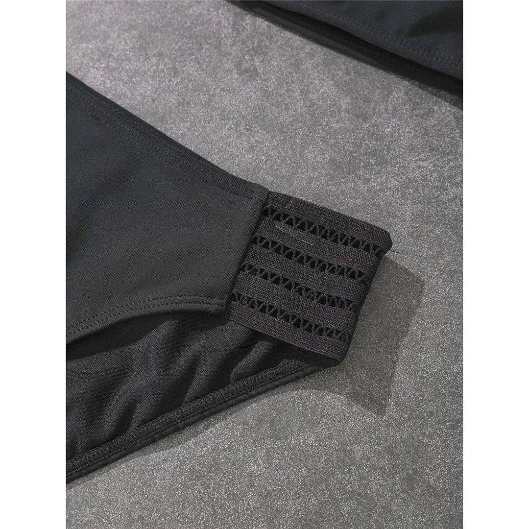 Halter mid-waist black bikini set with padded support for a timeless and elegant swimwear option for women.