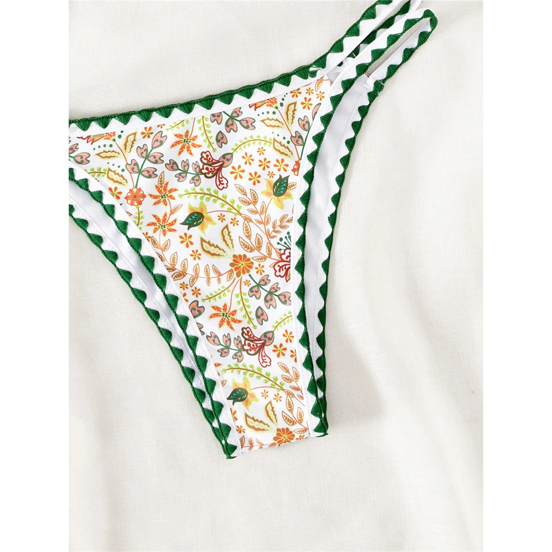 Women's Flower Printed Halter Brazilian Bikini Set with Floral Print Design. Made from Nylon and Spandex, Fits True to Size, with Wire Free Support. Features a Low Waist Design for a Flattering Look. Available in Sizes S, M, L and in Colors Dark Green Print, Dark Green, and Multicolor. Perfect for a Vibrant and Stylish Beachwear Option.