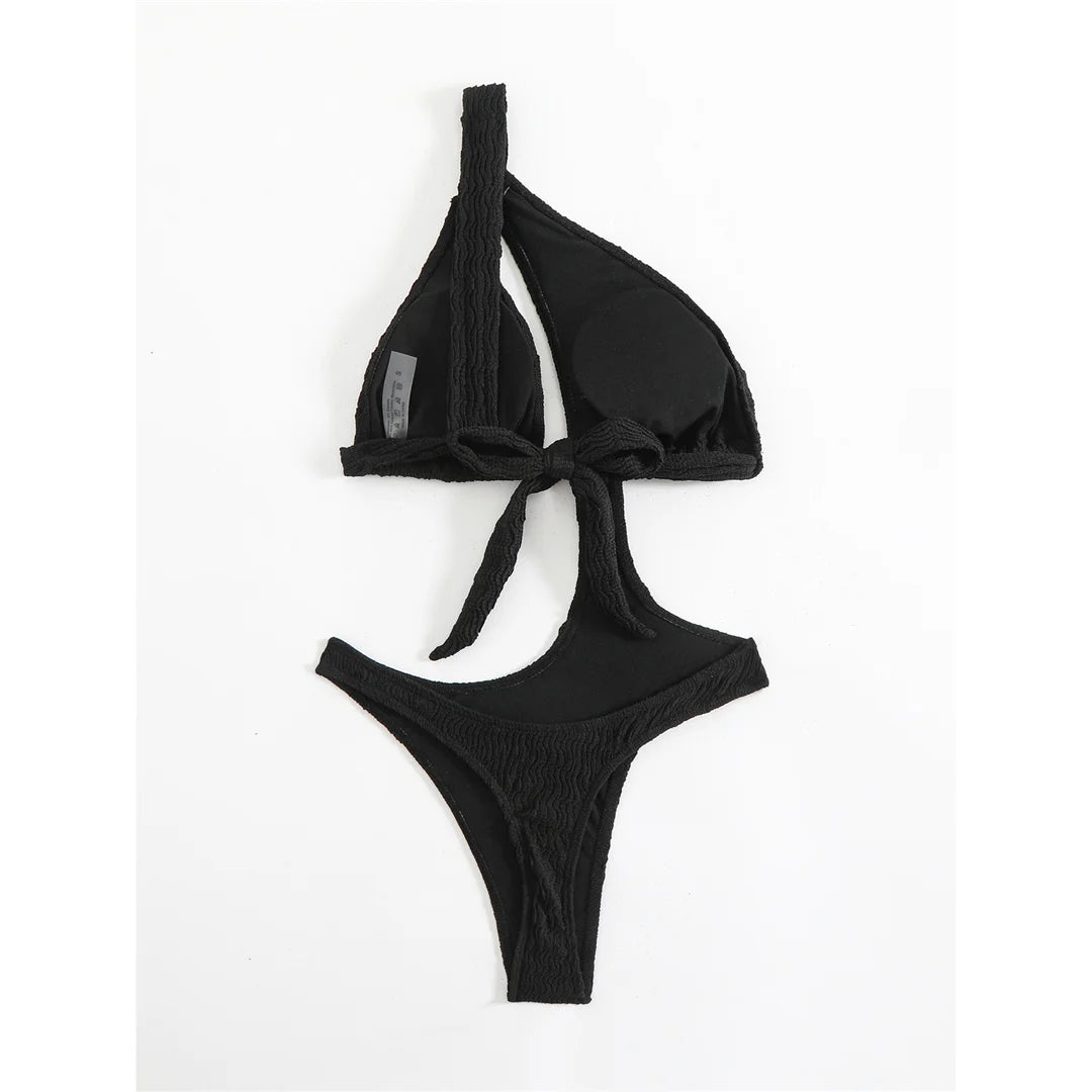 Asymmetric One Shoulder Crinkled Swimsuit with a modern design, crinkled texture, solid monochrome, polyester and spandex blend, adjustable strap for a chic fit.