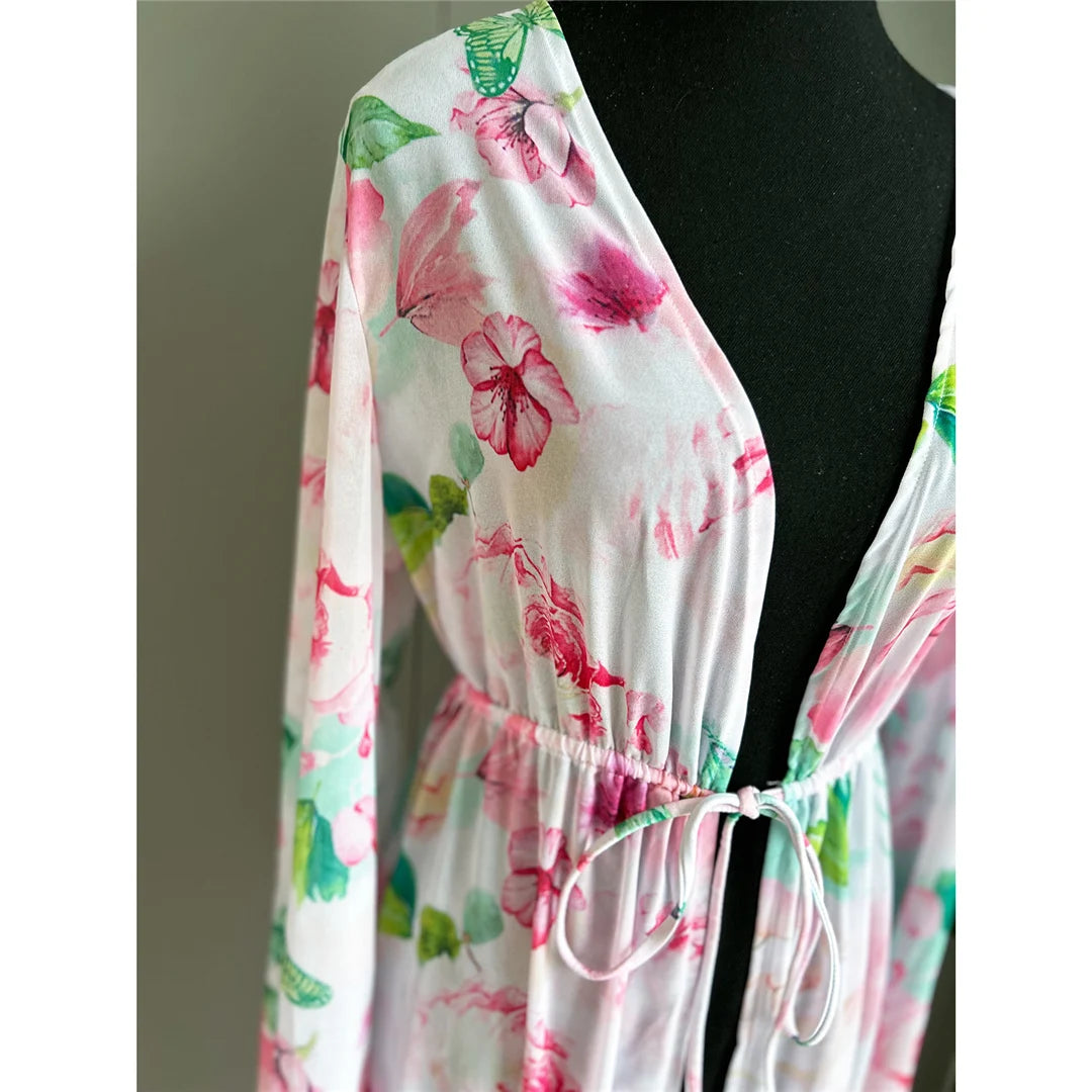 Flowers Printed Long Sleeve Tunic Beach Cover Up with floral pattern and chic belt detail, Polyester material, combines style and comfort, offers elegance and sun protection for women.