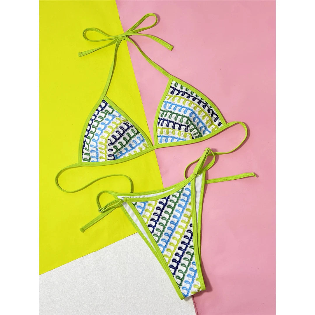 Printed Halter High Leg Cut Bikini Set for women. This striking two-piece bikini made of nylon and spandex features a head-turning print, wire-free support, low waist, and includes padding. Fits true to size, available in sizes S, M, L. Perfect for adults aged 18-35. This product is in stock and offers free shipping. Available in green and multicolor.