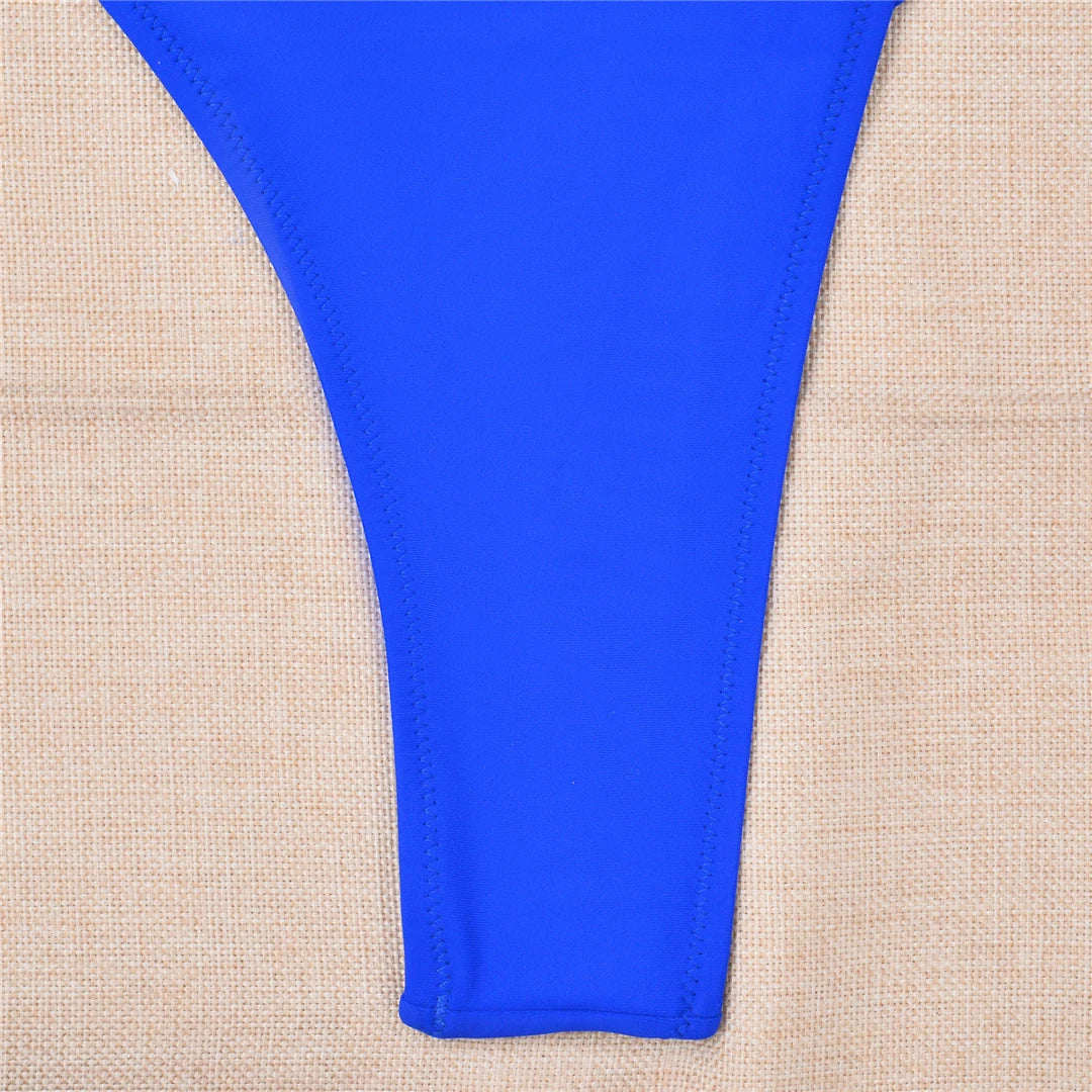 Bold Cut Out Halter One Piece Swimsuit for Women. This unique monokini features a halter neckline and high-leg cut, designed to elongate your silhouette and enhance your form. Made from comfortable and durable Nylon and Spandex materials in solid colors. This daring swimsuit is available in sizes S to XL and comes in five striking colors: Black, Royal Blue, Coffee, Yellow, and Lake Green. In stock and ready for summer, this swimsuit is ideal for adults aged 18-35 and comes with free shipping.