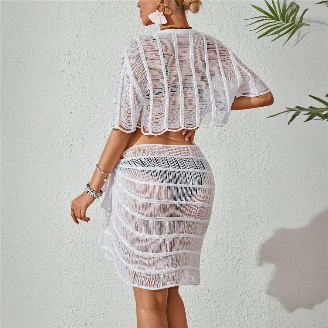 Short sleeve hollow out knitted beach cover-up set in solid white for women, perfect for stylish layering over swimwear.