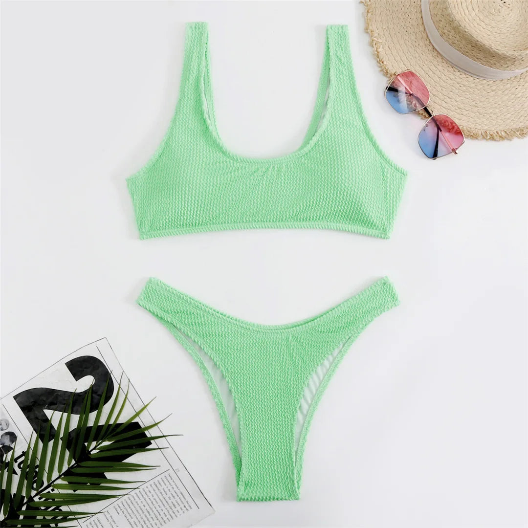 High cut bikini set in eight colors with wrinkled crinkled texture and solid design for a chic and flattering fit.