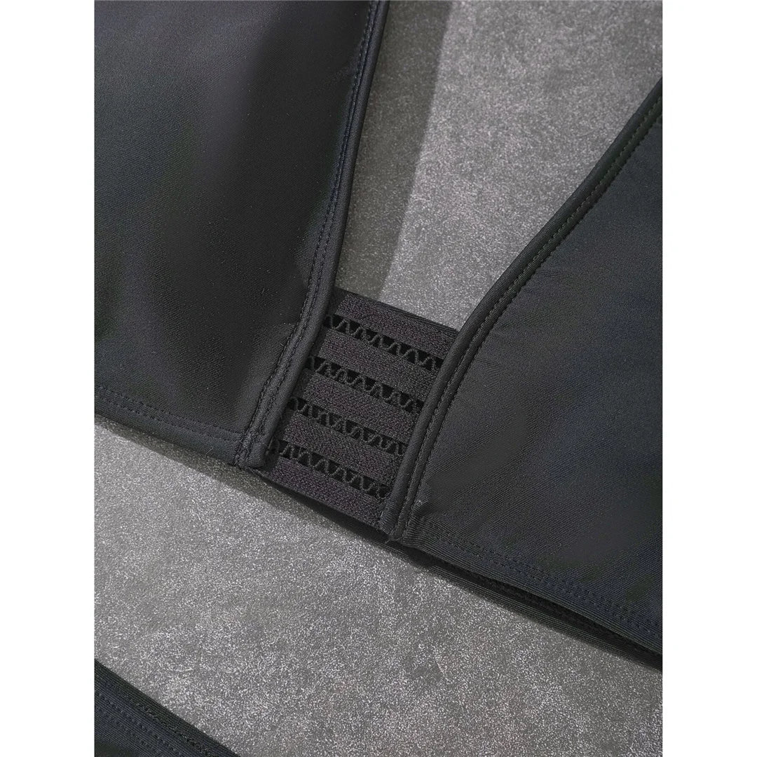 Halter mid-waist black bikini set with padded support for a timeless and elegant swimwear option for women.