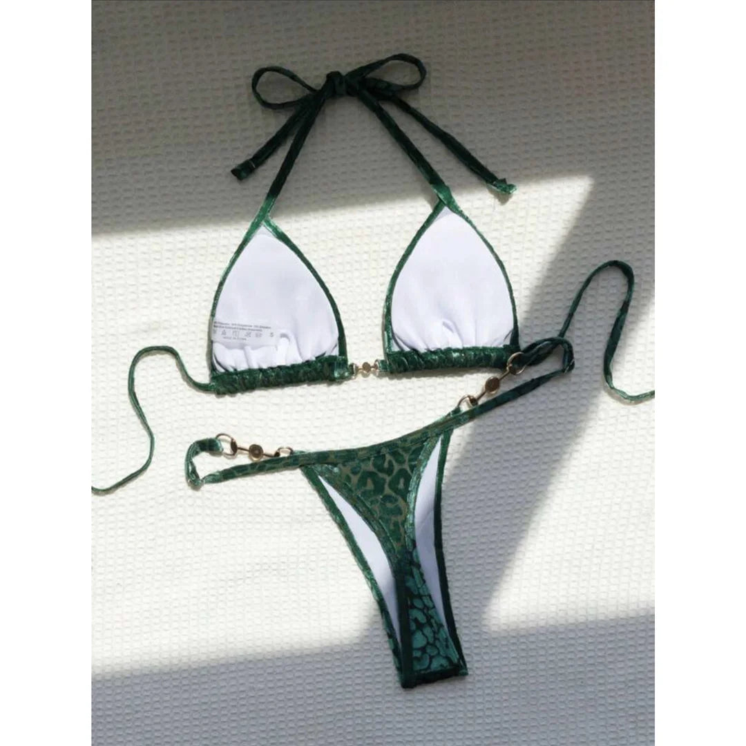 Leopard Print Mini Micro Thong Bikini Adorned with Delicate Pearls. Two-Piece Swimwear made of Nylon and Spandex. Features Low Waist, Wire-Free Support, and True to Size Fit. Pattern: Leopard Print. Includes Padded Cups, Available in Sizes: S, M, L, Female, Varleinsar, V5207. Colors Available: Blue Leopard, Green Leopard, Yellow Blue Leopard. In-Stock with Free Shipping.