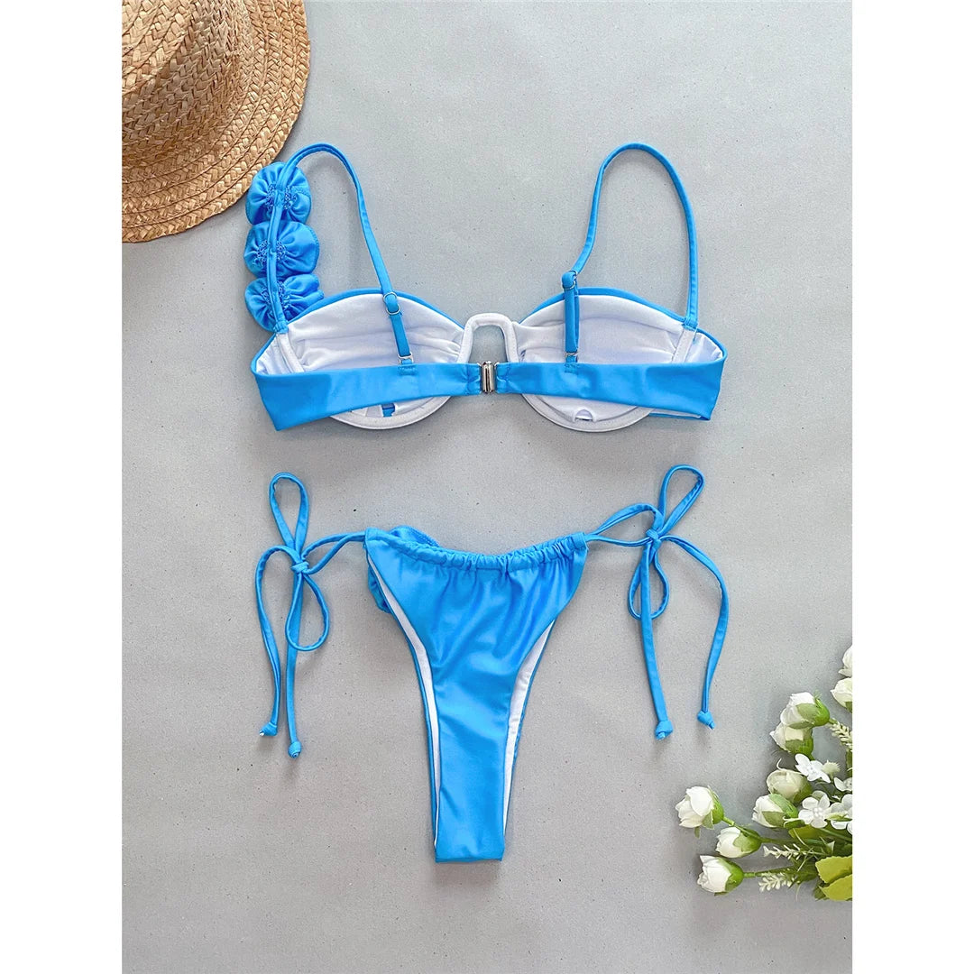 Dive into Elegance with Our Charming Two-Piece Bikini Set Adorned with Exquisite 3D Flowers and Supportive Underwire in Blue, Made from Nylon and Spandex. Features High-Leg Cut, Low Waist and True to Size Fit. Ideal for Middle Aged Women. Comes with Padding for Extra Comfort. Brand New and in Stock.
