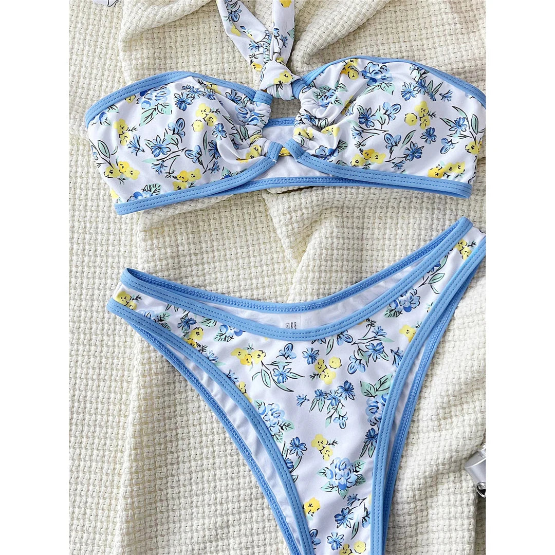 Floral flower printed Brazilian bikini set with vibrant print and low waist design for a fun and stylish beach look.