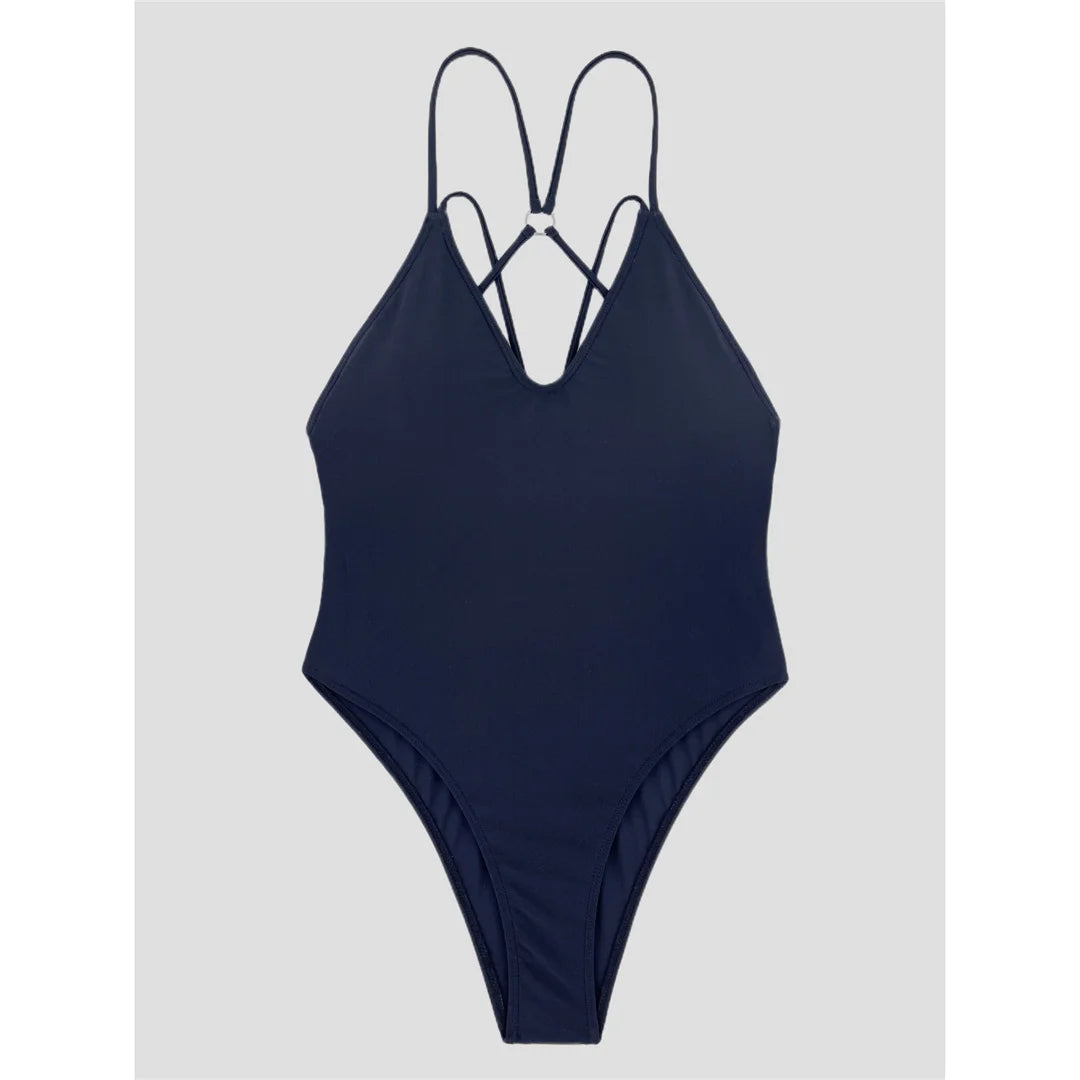 Elegant Cross Back V Neck Monokini in Black. This high leg, padded, one-piece swimsuit made of nylon and spandex provides both support and a sleek silhouette. Featuring a unique cross-back detail and fitting true to size, this wire-free swimwear is perfectly designed for women. It's an ideal choice for a refined beachside look that embraces both comfort and sophistication.