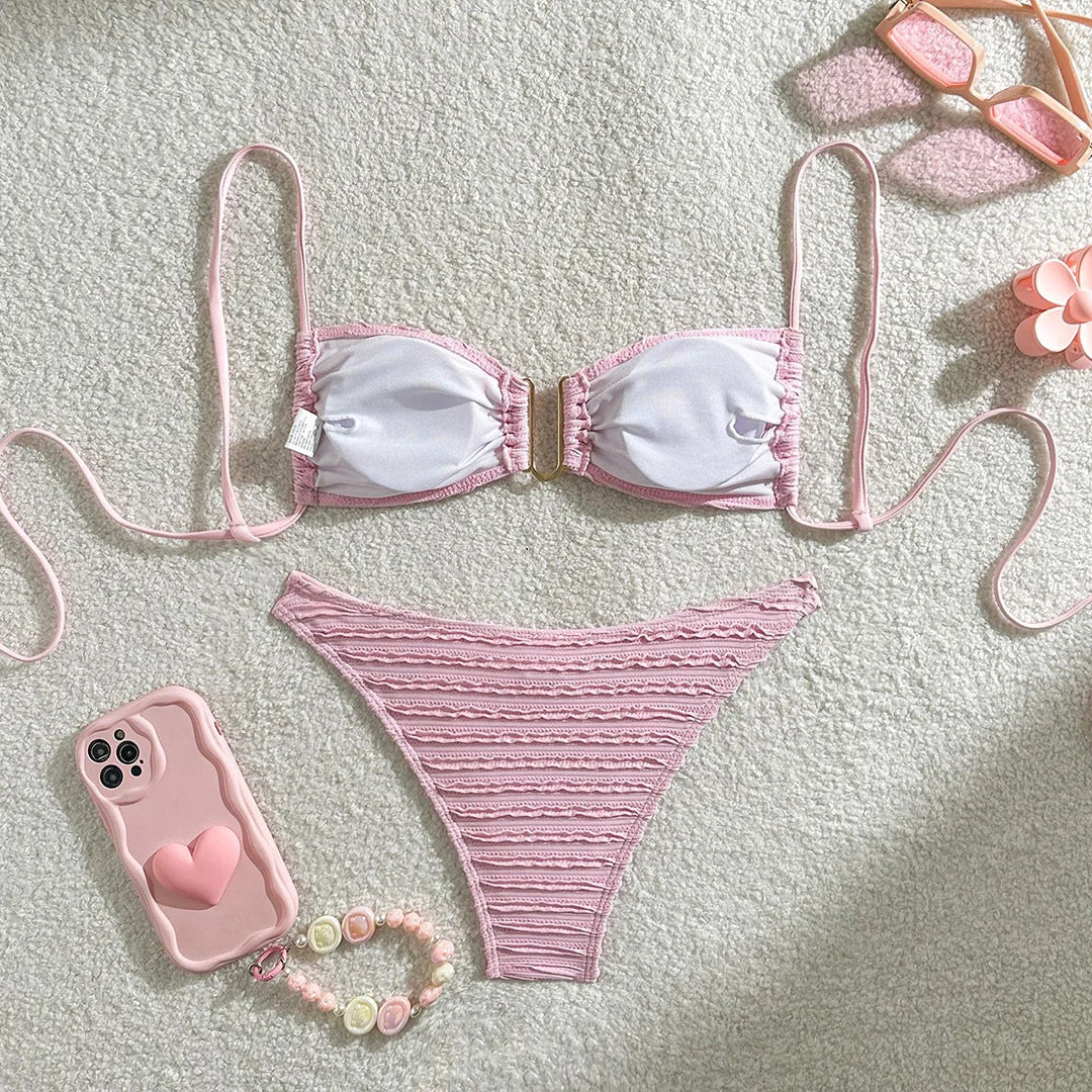 Elevate your beach style with a U neck wrinkled crinkled bikini set, featuring a unique texture and flattering U neck design. This fashionable two-piece swimsuit includes a high leg cut for a sleek modern look. Made from polyester and spandex, it offers a wire-free low waist fit, with supportive pads for comfort and standout appearance on sunny adventures. Available in multiple colors.