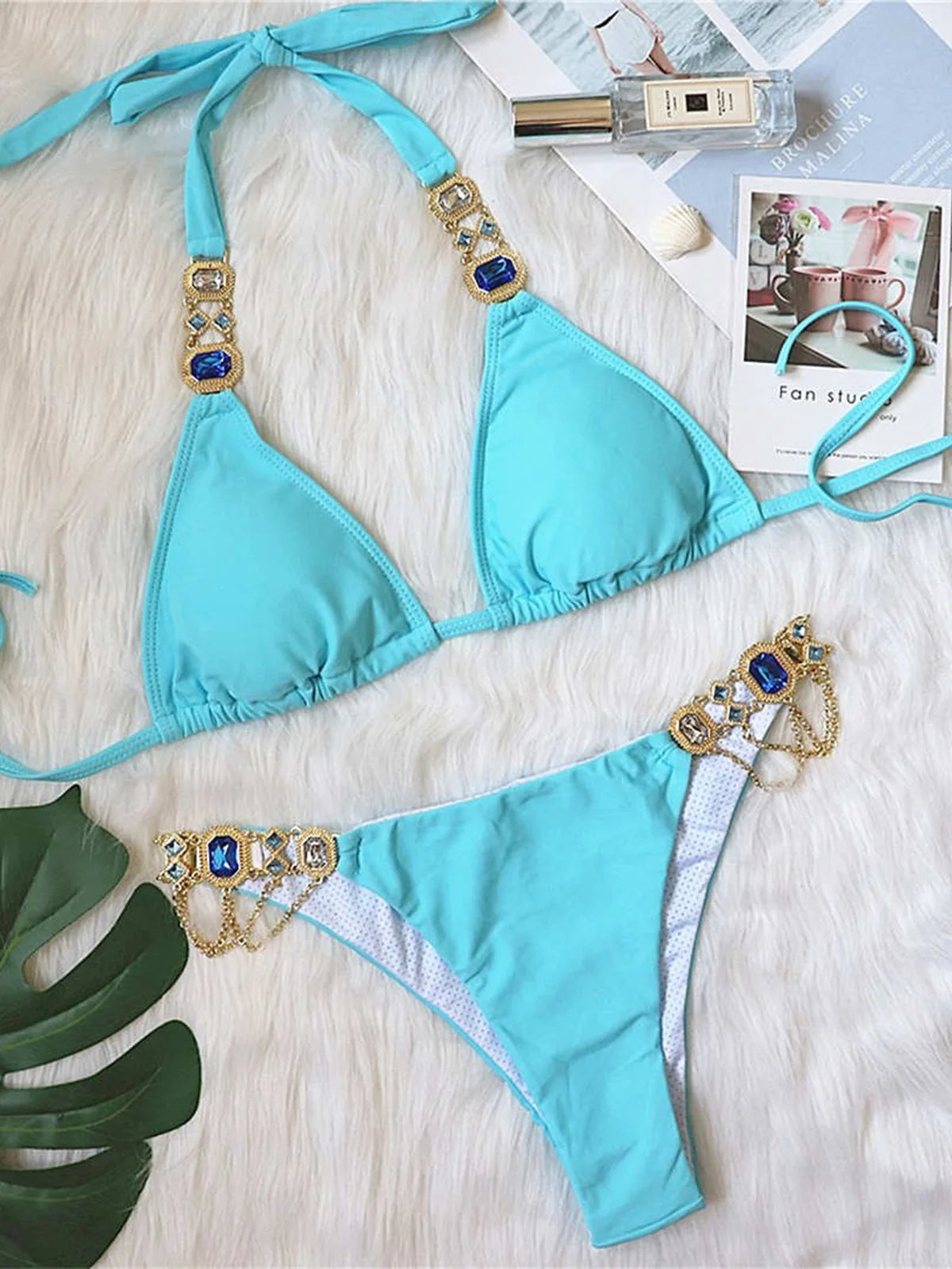 Opulent jewelled rhinestones luxury diamond bikini set available in Yellow, Red, Hot Pink, White, Silver, Purple, Sky Blue, and Black. A shimmering two-piece swimsuit made from nylon and spandex, featuring wire-free support and low waist design. Fits true to size, perfect for women who seek glamour and luxury in their swimwear.