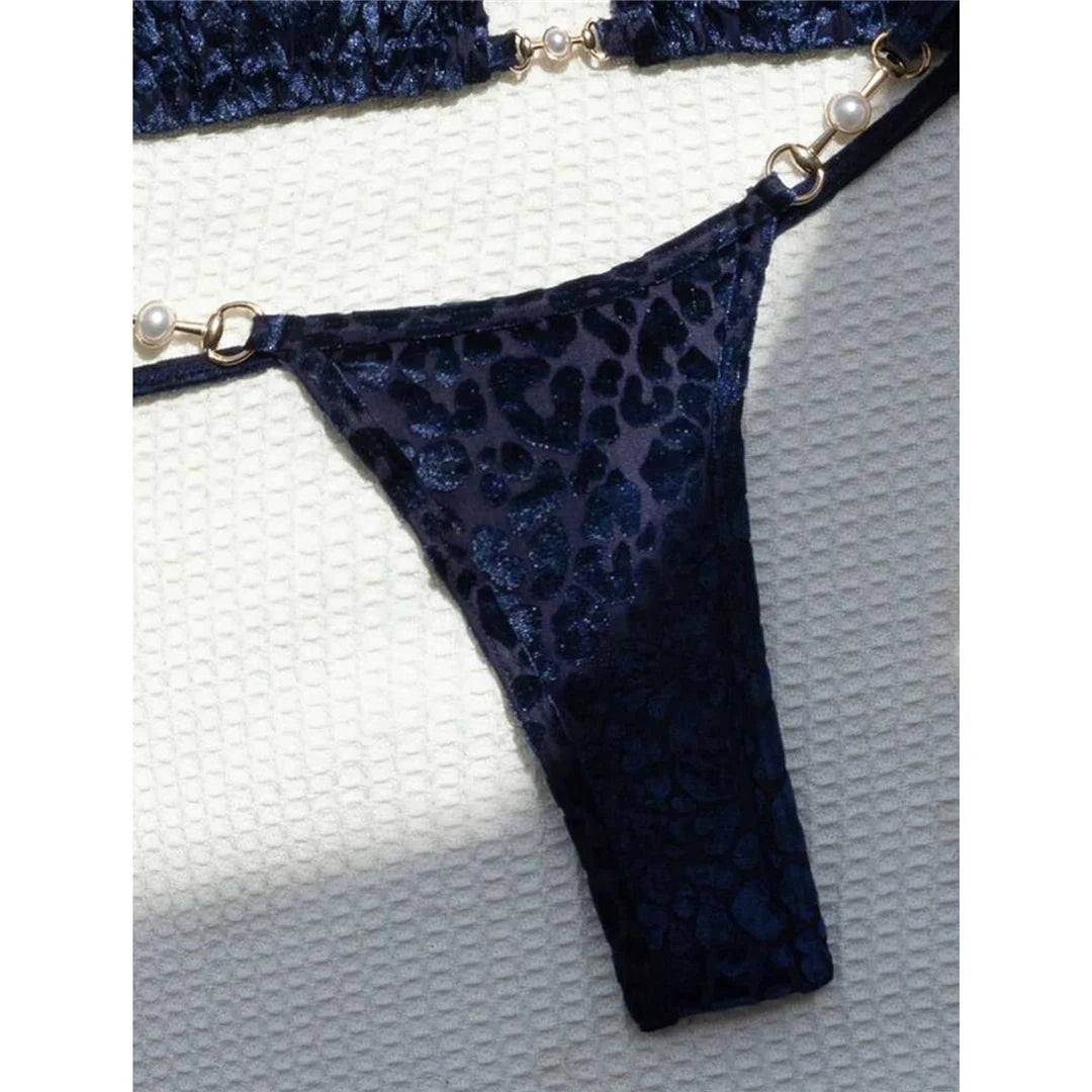 Leopard Print Mini Micro Thong Bikini Adorned with Delicate Pearls. Two-Piece Swimwear made of Nylon and Spandex. Features Low Waist, Wire-Free Support, and True to Size Fit. Pattern: Leopard Print. Includes Padded Cups, Available in Sizes: S, M, L, Female, Varleinsar, V5207. Colors Available: Blue Leopard, Green Leopard, Yellow Blue Leopard. In-Stock with Free Shipping.