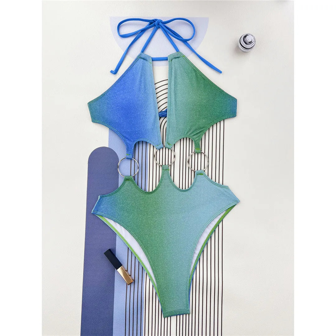 Glittering Halter One-Piece Swimsuit with Cut-Out and High Cut Design. Available in Solid Colors Blue, Green and Multicolor. Made of Nylon and Spandex, Fits True to Size. One Piece with Free Support and Pad Included. Sizes Range from S to XL. Available in Stock with Free Shipping