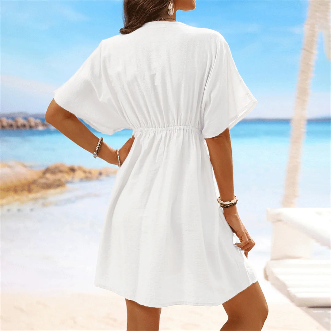 Lace Short Sleeve Tunic with a flattering V-neckline, a perfect beach cover-up available in sizes S to XL. Made of Nylon, Polyester, and Cotton, this Tunic is available in Black, Dark Blue, Green, Hot Pink, Peach Red, Peach, Red, Multicolor, Sky Blue, White, and Beige. Its lightweight fabric and intricate lace details provide a breathable, relaxed fit, perfect for sunny days and transitions seamlessly from the beach to casual outings.