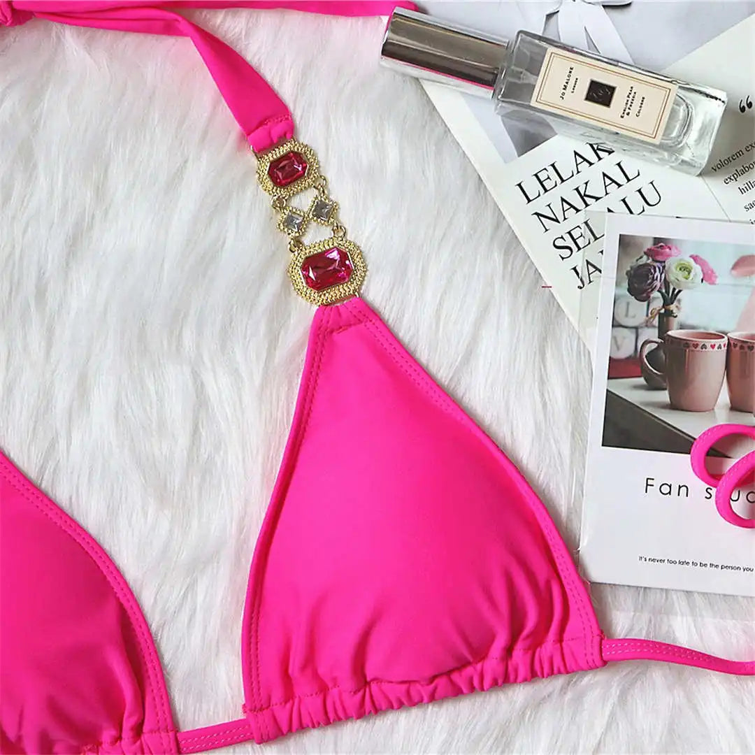 Opulent jewelled rhinestones luxury diamond bikini set available in Yellow, Red, Hot Pink, White, Silver, Purple, Sky Blue, and Black. A shimmering two-piece swimsuit made from nylon and spandex, featuring wire-free support and low waist design. Fits true to size, perfect for women who seek glamour and luxury in their swimwear.