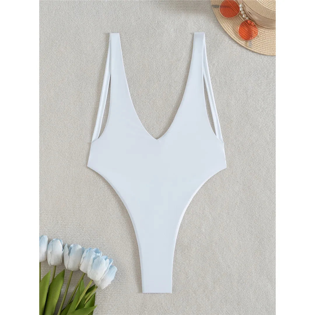 Deep V neck one piece swimsuit in solid white with mini micro thong, high cut design, and adjustable straps for women.