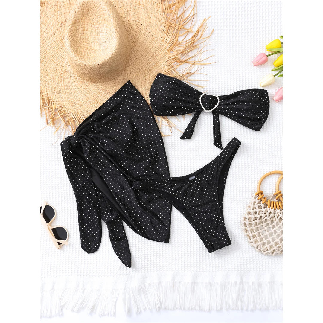 Polka dots bandeau bikini set with matching sarong, three-piece ensemble, polyester spandex blend, wire-free support, low waist, women's dot swimwear, playful and retro style.