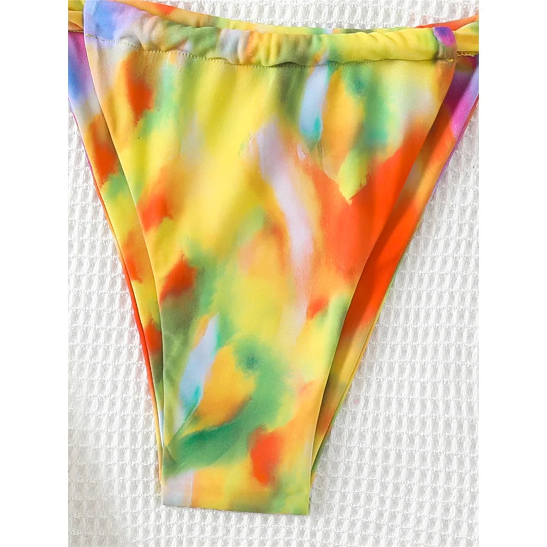 Printed tie-dye high-leg bikini set with vibrant pattern and padded design for a fun and flattering look for women.