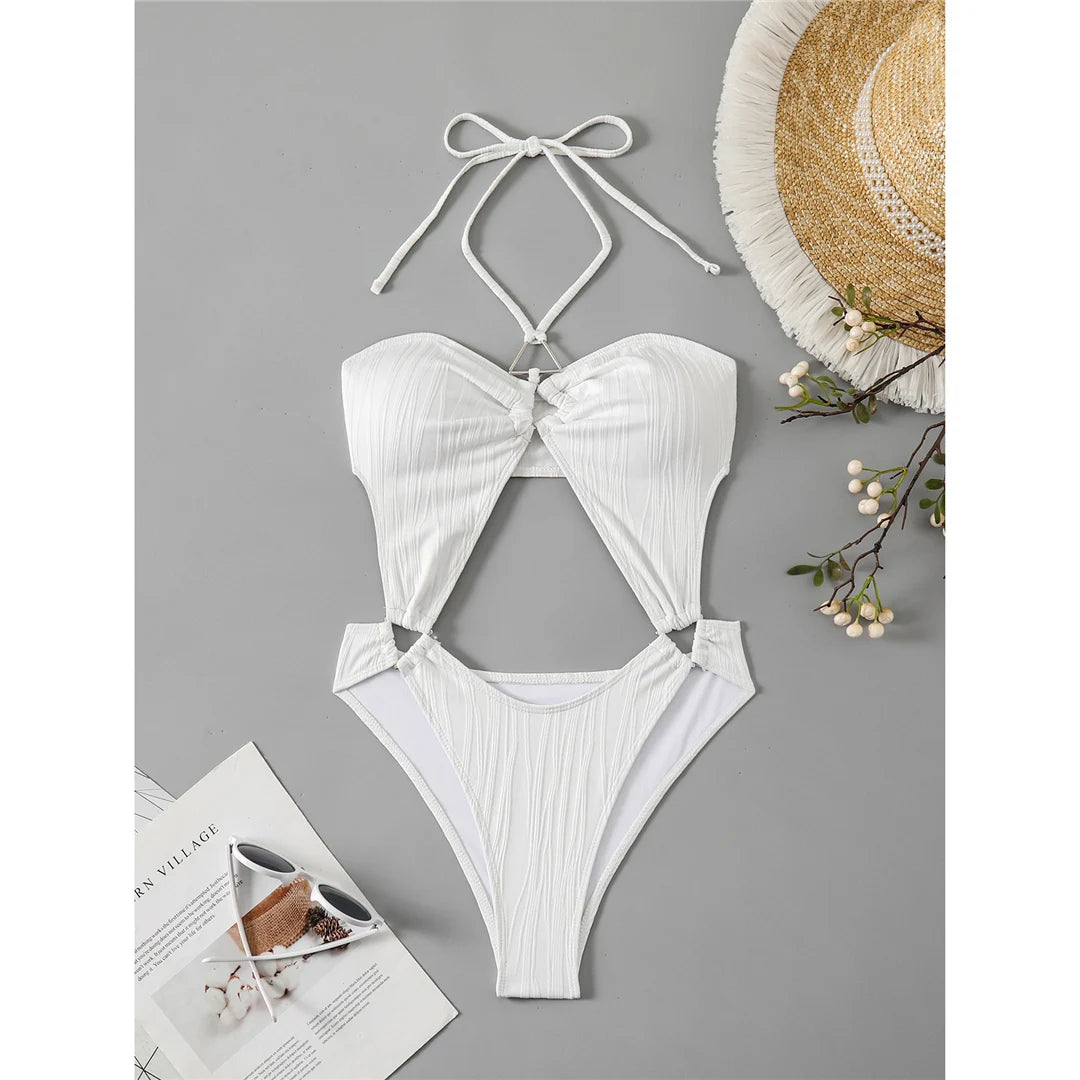 Tummy cut-out halter swimsuit in white, offering a sophisticated and modern fit in one piece design.