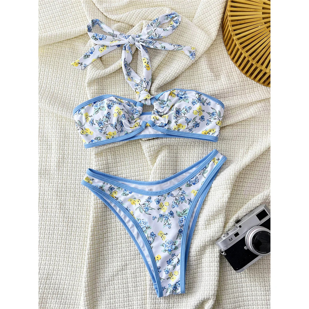 Floral flower printed Brazilian bikini set with vibrant print and low waist design for a fun and stylish beach look.