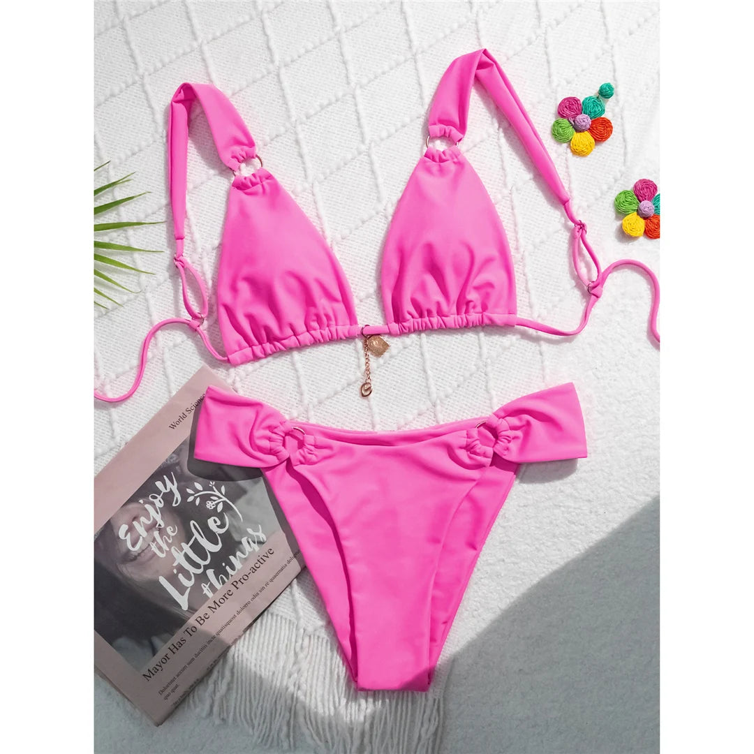 High-leg cut bikini set with stylish metal ring details and padded design for a chic and modern swimwear look for women.