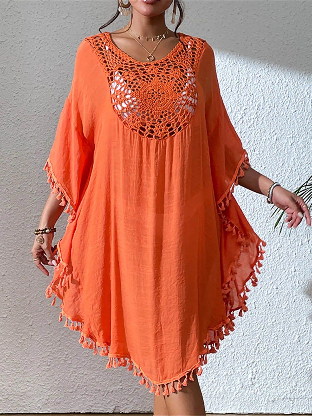 Fringe Tassel Embroidery Beach Cover-Up for women. Bohemian style tunic featuring half sleeves and long beach dress design. Made of nylon, polyester, rayon, and cotton. Fits true to size in sizes S, M, L, perfect for adults aged 18-35. This product is in stock with free shipping and available in orange, white, and black colors.