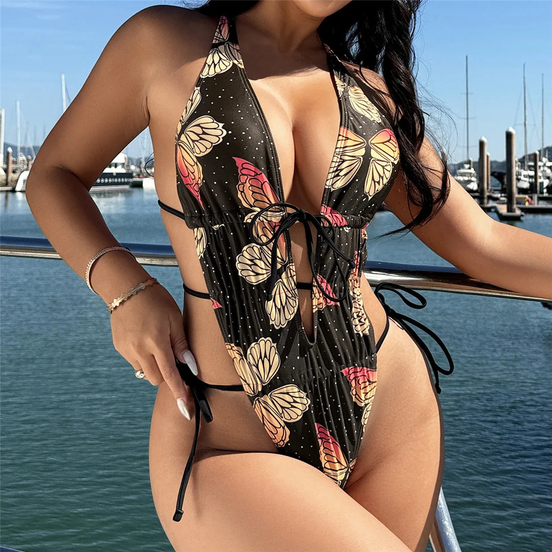 Butterfly printed deep V neck backless one piece swimsuit with high cut silhouette and adjustable straps for women.