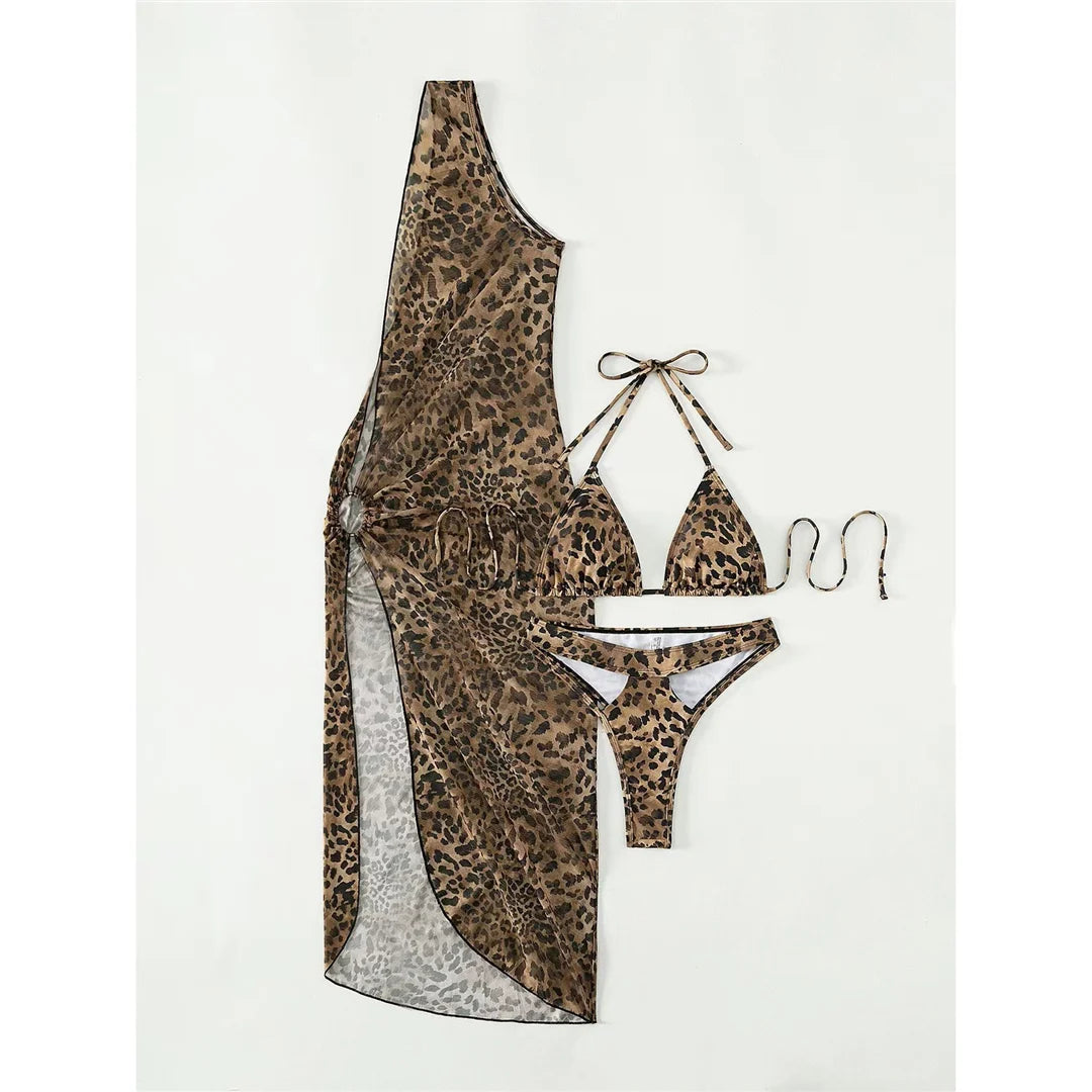 Fierce Leopard Print Halter Bikini Set for Women with Sleek Cover-Up, Three Piece Collection. Made from Nylon and Spandex, it offers a Low Waist, Wire Free fit. Perfect for lounging poolside or beachside parties.