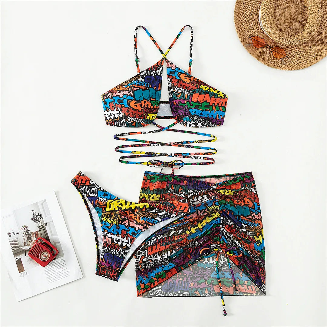 Women's Printed Wrap Around Bikini Set with Skirt in Print Pattern. Three-Piece Beachwear Made from Nylon and Spandex, Features a Low Waist Design and Wire Free Support, Fits True to Size. This Ensemble Includes a Wrap Around Bikini Top, Matching Bottoms, and a Coordinating Skirt. Available in Sizes S, M, L.