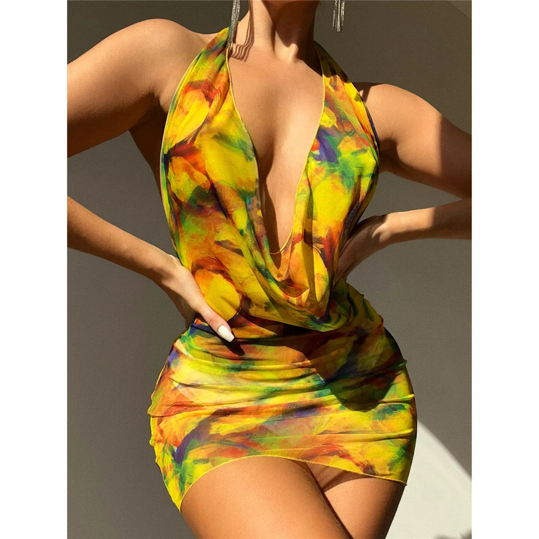 Captivating Printed Halter Tunic Beach Cover-Up with Backless Design, Made from Nylon, Polyester, Rayon, and Cotton. Ideal for Women Aged 25-34, Offering a Chic Layer of Coverage With a Multicolor Design of Orange and Yellow. Fits True to Size and is New and in Stock.