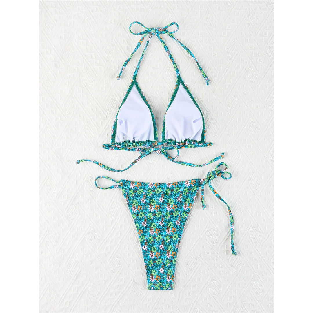 Vibrant Four-Color Halter Bikini Set with Captivating Flower Print, Made from Nylon and Spandex. Features High-Leg Cut, Wire Free Support and Low Waist Style in Green, Blue and Yellow Colors. Fits True to Size, Ideal for Middle Aged Women. Comes with Padding for Extra Comfort. Brand New and Available in Stock.