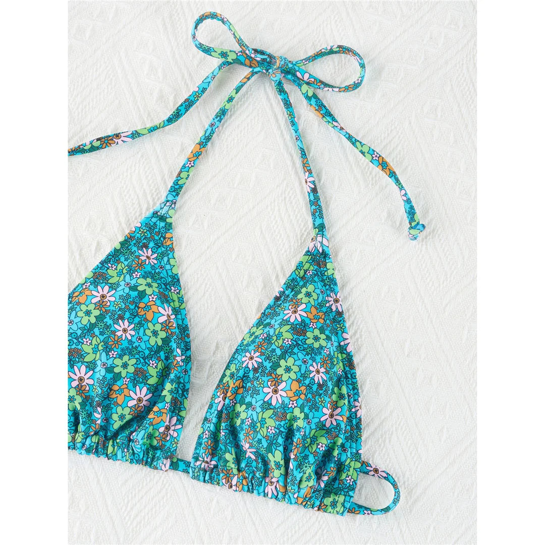 Vibrant Four-Color Halter Bikini Set with Captivating Flower Print, Made from Nylon and Spandex. Features High-Leg Cut, Wire Free Support and Low Waist Style in Green, Blue and Yellow Colors. Fits True to Size, Ideal for Middle Aged Women. Comes with Padding for Extra Comfort. Brand New and Available in Stock.