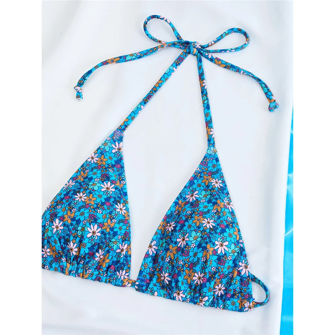 Vibrant Four-Color Halter Bikini Set with Captivating Flower Print, Made from Nylon and Spandex. Features High-Leg Cut, Wire Free Support and Low Waist Style in Green, Blue and Yellow Colors. Fits True to Size, Ideal for Middle Aged Women. Comes with Padding for Extra Comfort. Brand New and Available in Stock.
